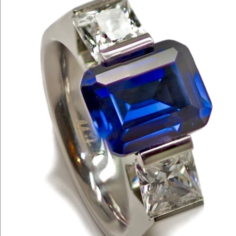 Nwt BTiff NY ring Dazzling blue emerald cut center stone dazzling side stones.
